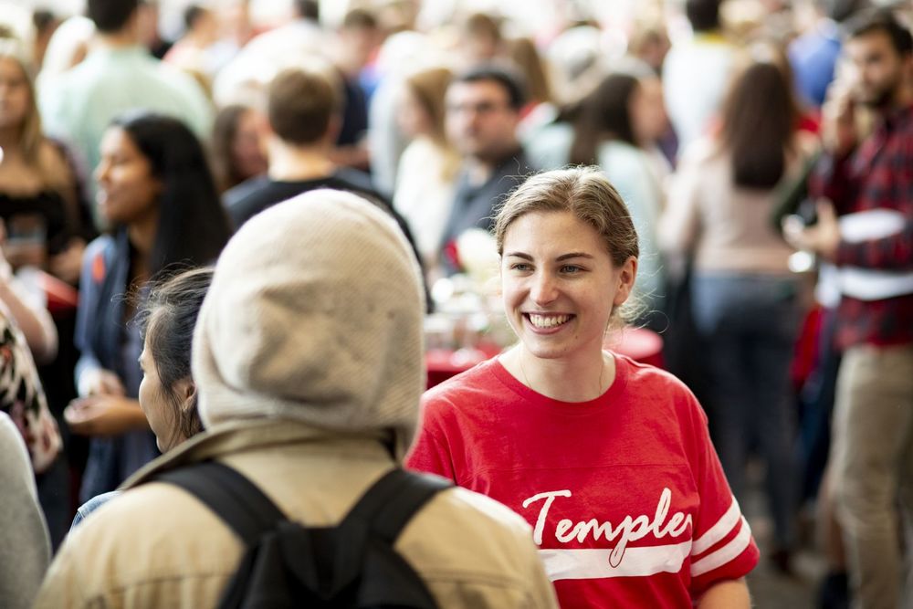 A Temple student speaks with other students on Match Day.